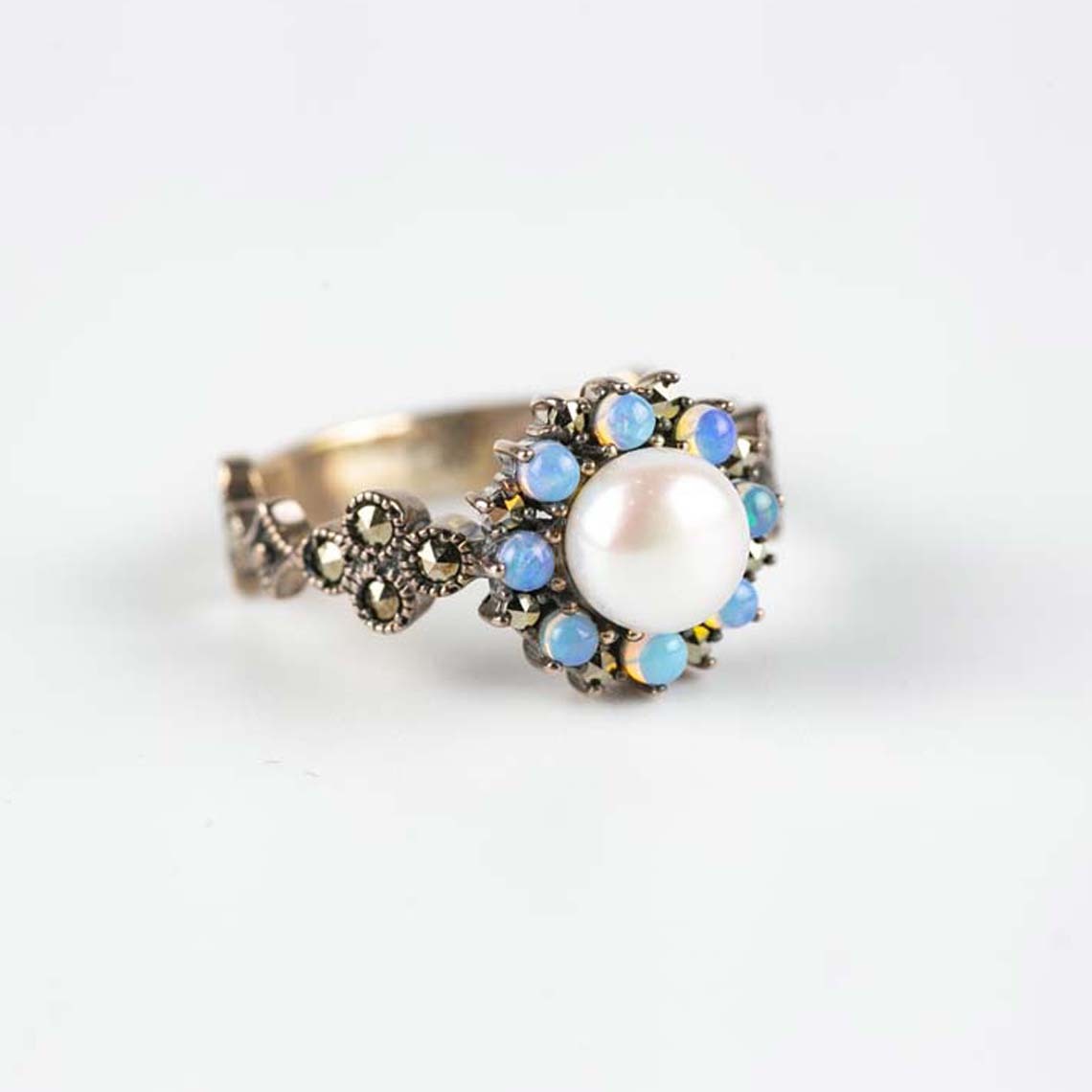 White round pearl, round opal and marcasite